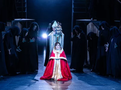 Coronation of the Pope - The Popess kneels while the papal crown is placed on her head
